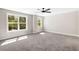 Spacious bedroom with large windows and plush gray carpeting at 1518 Stanwick Dr, Johns Island, SC 29455