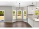 Dining area featuring large windows, pendant lighting, and views of the backyard at 1518 Stanwick Dr, Johns Island, SC 29455