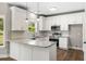 Kitchen with white cabinets, granite countertops, stainless steel appliances, pendant lighting, and a subway tile backsplash at 1518 Stanwick Dr, Johns Island, SC 29455