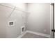 Clean laundry room with shelving and modern tile flooring, offering functionality and style at 1518 Stanwick Dr, Johns Island, SC 29455