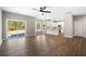 Open concept living room and kitchen area featuring hardwood floors, natural light, and access to the patio at 1518 Stanwick Dr, Johns Island, SC 29455