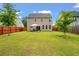 Spacious backyard with a well-maintained lawn and fenced perimeter at 153 Caleb Ct, Ladson, SC 29456