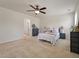 Bright bedroom featuring a ceiling fan, neutral carpet, and coordinated furnishings at 153 Caleb Ct, Ladson, SC 29456