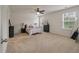 Spacious bedroom with neutral carpeting, ceiling fan, and lots of natural light at 153 Caleb Ct, Ladson, SC 29456