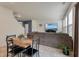 Dining area with seating for four, adjacent to a cozy living room with TV at 153 Caleb Ct, Ladson, SC 29456