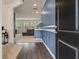 Bright entryway with hardwood floors, blue accent wall and access to the living area at 153 Caleb Ct, Ladson, SC 29456