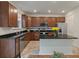 Well-equipped kitchen featuring stainless steel appliances, granite countertops, and wood cabinets at 153 Caleb Ct, Ladson, SC 29456