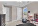 This bedroom features a window with blinds, ceiling fan, and a side table with a lamp at 1541 Homecoming Blvd, Ravenel, SC 29470