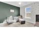 Welcoming Bedroom with a crib, comfortable chair, airplane wallpaper, and plenty of natural light at 1541 Homecoming Blvd, Ravenel, SC 29470