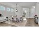 Bright dining room featuring a decorative chandelier, a light-colored rug, and lots of natural light at 1541 Homecoming Blvd, Ravenel, SC 29470