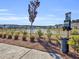 Convenient dog waste station near a serene pond for pet-friendly living in the community at 1541 Homecoming Blvd, Ravenel, SC 29470
