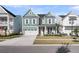Beautifully designed two-story home with a welcoming front porch and well-manicured lawn at 1541 Homecoming Blvd, Ravenel, SC 29470