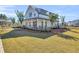 Beautifully landscaped home with a large porch and a spacious front yard at 1541 Homecoming Blvd, Ravenel, SC 29470