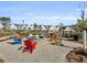 Community fire pit area with colorful chairs and seating for residents to enjoy at 1541 Homecoming Blvd, Ravenel, SC 29470
