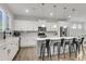 Well-lit kitchen with a large island and stainless steel appliances, showcasing modern design at 1541 Homecoming Blvd, Ravenel, SC 29470