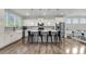Bright kitchen with an island and seating, complemented by stainless steel appliances and ample counter space at 1541 Homecoming Blvd, Ravenel, SC 29470