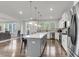 Spacious kitchen featuring a center island, seamlessly flowing into the living space at 1541 Homecoming Blvd, Ravenel, SC 29470