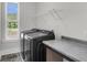 Laundry room featuring modern appliances and countertop space with a view from the window at 1541 Homecoming Blvd, Ravenel, SC 29470