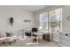 Bright home office with natural light, a modern desk, and comfortable seating area at 1541 Homecoming Blvd, Ravenel, SC 29470