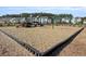 Community playground offering a safe and fun environment for children with swings and slides at 1541 Homecoming Blvd, Ravenel, SC 29470