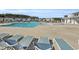 Community pool with lounge chairs and water features at 1541 Homecoming Blvd, Ravenel, SC 29470