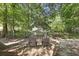 Secluded backyard setting with two chairs and a wooden fence providing privacy and a peaceful outdoor space at 177 Sugar Magnolia Way, Charleston, SC 29414