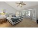 Bedroom with a bay window, ceiling fan and neutral decor at 177 Sugar Magnolia Way, Charleston, SC 29414
