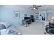 Bright bonus room offering a large workstation and built-in shelving for media and books at 177 Sugar Magnolia Way, Charleston, SC 29414
