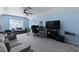 Spacious bonus room with a comfortable seating area, desk and large screen television at 177 Sugar Magnolia Way, Charleston, SC 29414