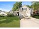 Charming home featuring a well-manicured lawn and a two-car garage at 177 Sugar Magnolia Way, Charleston, SC 29414
