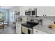 Kitchen featuring stainless steel appliances, including a microwave, oven, and stovetop at 177 Sugar Magnolia Way, Charleston, SC 29414