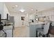Bright kitchen with granite countertops, stainless steel appliances, and island seating at 177 Sugar Magnolia Way, Charleston, SC 29414