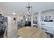 Open layout view of the kitchen, dining, and living areas, filled with natural light at 177 Sugar Magnolia Way, Charleston, SC 29414