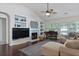 Cozy living room with fireplace and built-in shelving at 177 Sugar Magnolia Way, Charleston, SC 29414