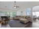 Comfortable living room featuring vaulted ceilings and large windows at 177 Sugar Magnolia Way, Charleston, SC 29414