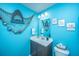 Whimsical powder room with unique shark-themed decor and playful accents at 1865 Towne St, Johns Island, SC 29455