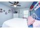 Bright bedroom with blue accent wall, white dresser and twin jellyfish at 1865 Towne St, Johns Island, SC 29455