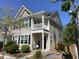 Charming two-story home featuring a welcoming front porch and landscaped yard at 1865 Towne St, Johns Island, SC 29455