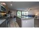 Gourmet kitchen with a large island, stainless steel appliances, and an open view to the living area at 1865 Towne St, Johns Island, SC 29455