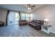 Welcoming living room featuring hardwood floors, sliding glass doors, and ceiling fan at 1865 Towne St, Johns Island, SC 29455