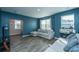 Comfortable living room featuring hardwood floors, a large window, and comfortable seating at 1865 Towne St, Johns Island, SC 29455