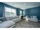 Bright living room featuring hardwood floors, abundant natural light, and comfortable seating at 1865 Towne St, Johns Island, SC 29455