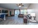 Relaxing living room with hardwood floors, sliding glass doors, and ceiling fan at 1865 Towne St, Johns Island, SC 29455