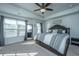 Bright main bedroom with large windows, neutral colors, and stylish furnishings for a relaxing retreat at 1865 Towne St, Johns Island, SC 29455
