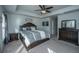 Serene main bedroom featuring a tray ceiling, neutral decor, and a well-appointed furniture set at 1865 Towne St, Johns Island, SC 29455