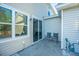 Outdoor patio with seating, sliding glass doors, and easy access to the backyard at 1865 Towne St, Johns Island, SC 29455