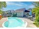 Backyard pool featuring a patio area with an outdoor dining set, perfect for relaxation and entertaining at 1929 Treebark Dr, Charleston, SC 29414