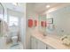 Bright bathroom featuring white vanity, a commode and a floral shower curtain at 1929 Treebark Dr, Charleston, SC 29414