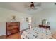 Inviting bedroom featuring wood floors, a patterned quilt, and vintage-style furniture at 1929 Treebark Dr, Charleston, SC 29414