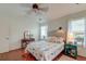 Bright bedroom with hardwood floors, a ceiling fan, and a cozy bed with a decorative quilt at 1929 Treebark Dr, Charleston, SC 29414